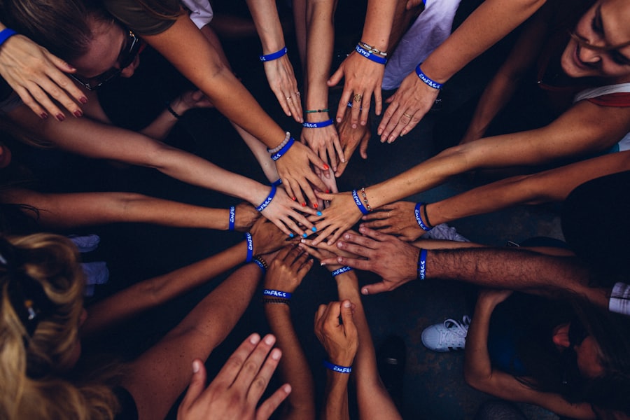 Staff and volunteers joining hands